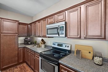 Kitchen with dark brown wood cabinetry